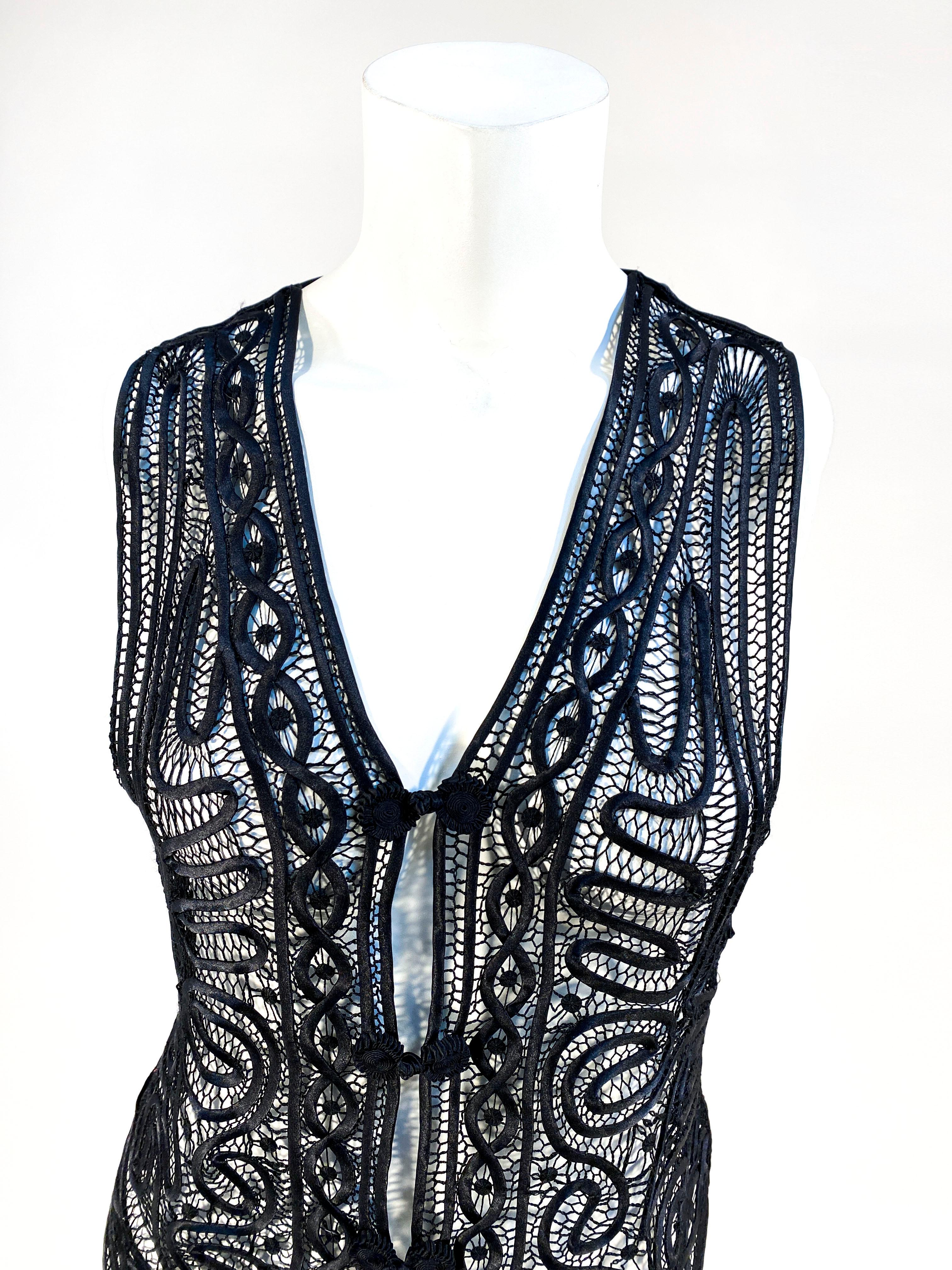 Early 20th Century black silk satin ribbon work and hand crochet vest in an intricate art neuveau patter. The front has three handmade frog closures in silk satin.