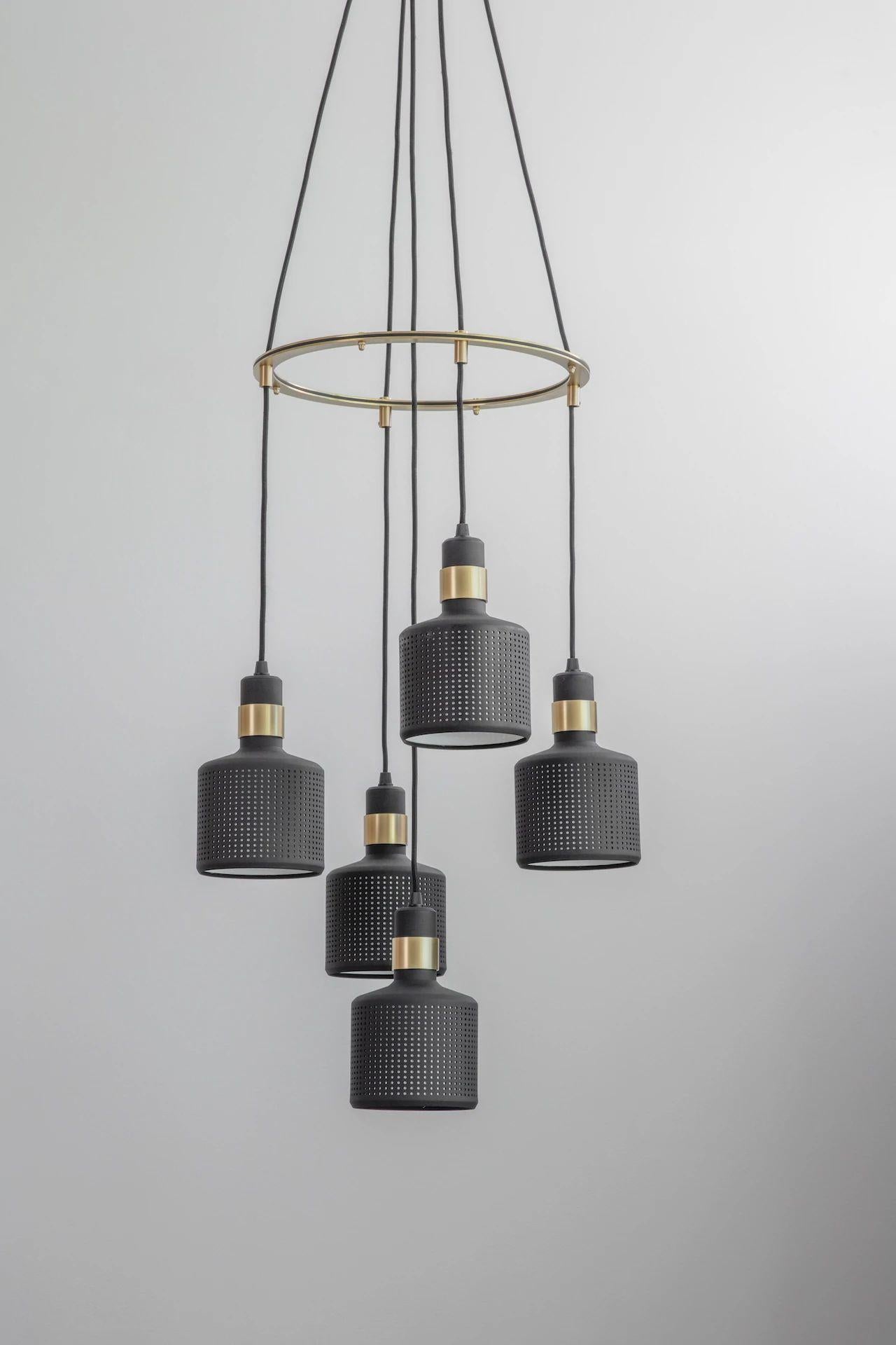 Black riddle cluster light 5 by Bert Frank.
Dimensions: H 20 x W 12 x D 12 cm each lamp.
Materials: brass and steel.

Available finishes: brass and black.
All our lamps can be wired according to each country. If sold to the USA it will be wired