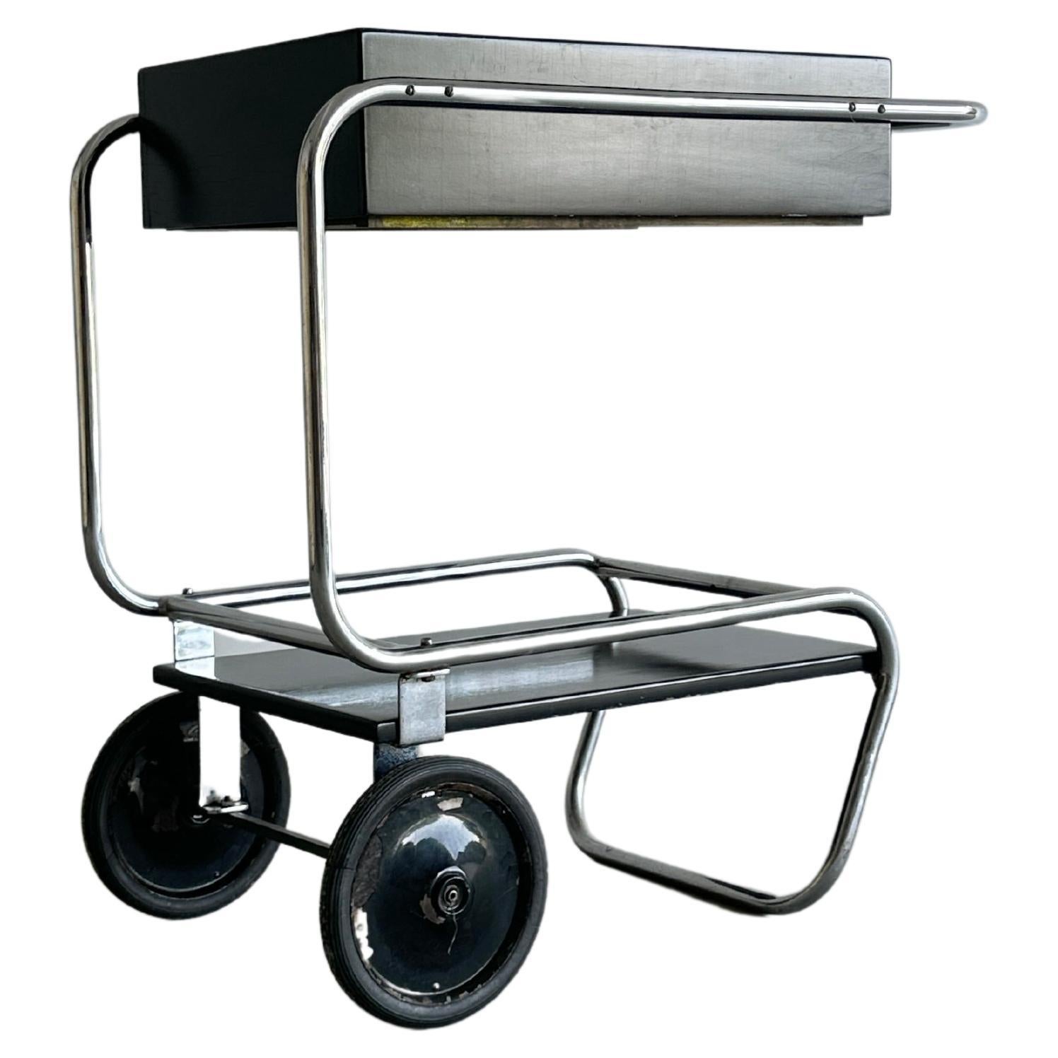 Black rolling chrome and wood bar cart by Gilbert Rohde for Troy Sunshade For Sale