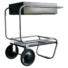 Black rolling chrome and wood bar cart by Gilbert Rohde for Troy Sunshade