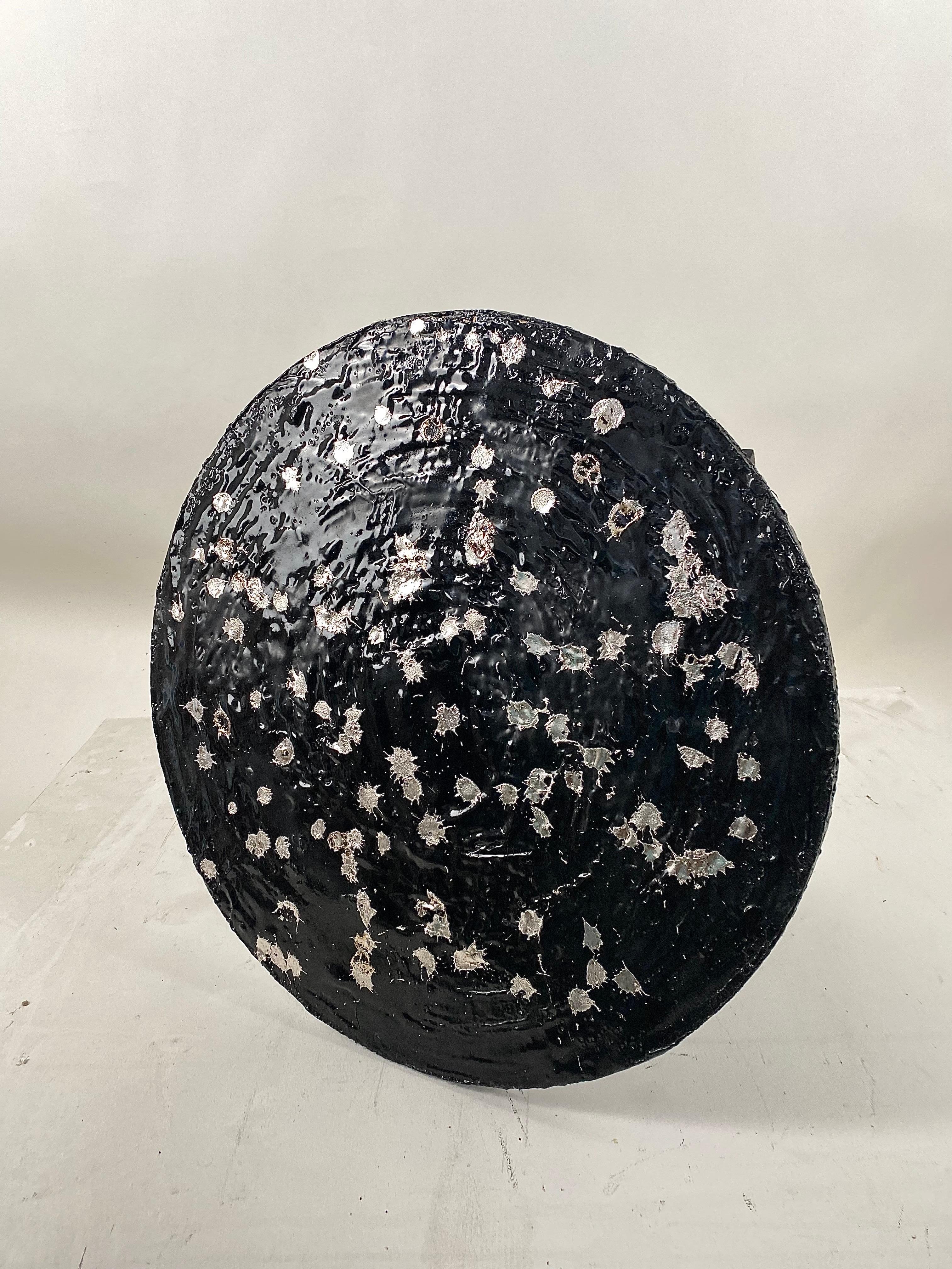Black round TAR painting with melted pewter