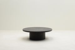 Black round brutalist stone resin coffee table, 70’s Netherlands.