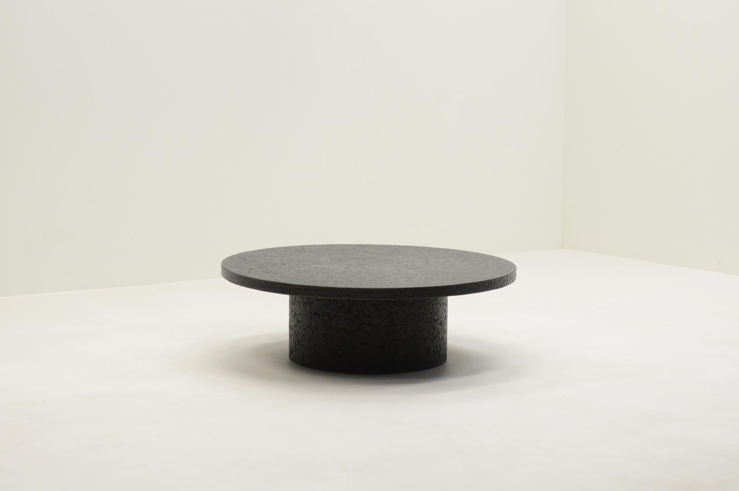 Brutalist Black round brutalist stone resin coffee table, 70’s Netherlands.