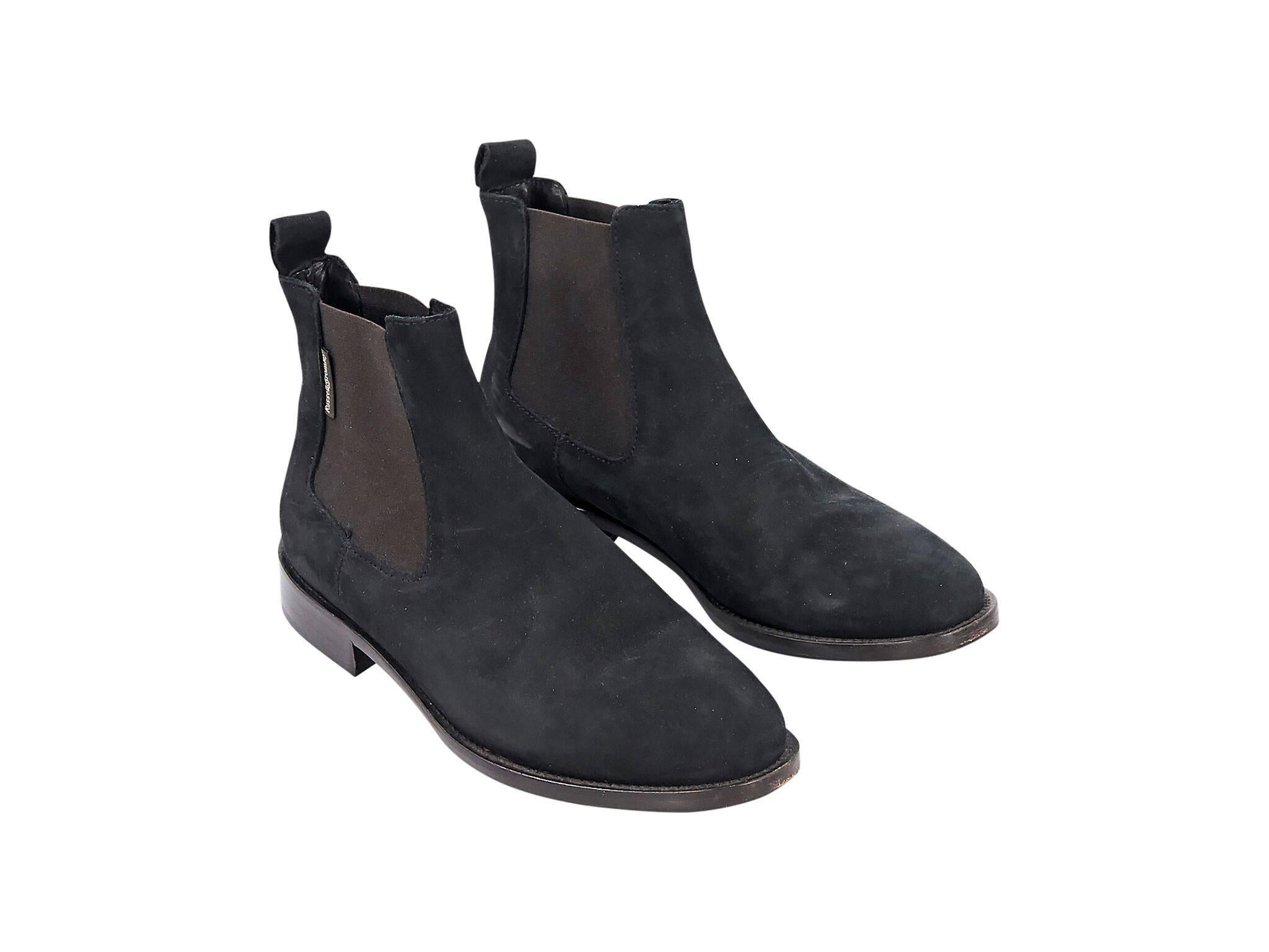 Product details:  Black suede Chelsea boots by Russell & Bromley.  Elasticized sides for easy fit.  Round toe.  Low stacked heel.  Pull-on style. 
Condition: Pre-owned. Very good.
Est. Retail $295