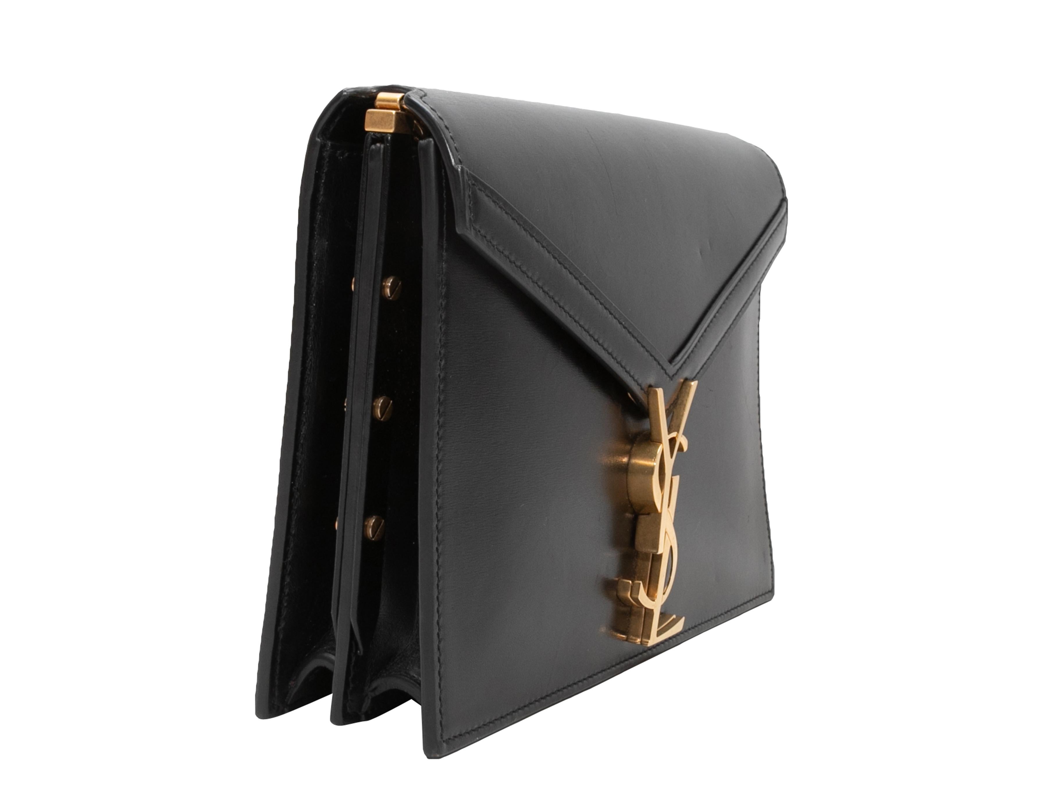 Black Saint Laurent Cassandra Medium Chain Bag. The Cassandra Medium Chain Bag features a leather body, gold-tone hardware, chain-link strap, and a front logo flap closure. 8.5