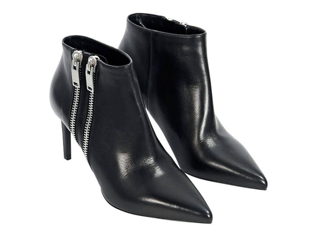 Product details:  Black leather ankle boots by Saint Laurent.  Double side zip.  Point toe.  Silvertone hardware.  Euro size 37.5.  3