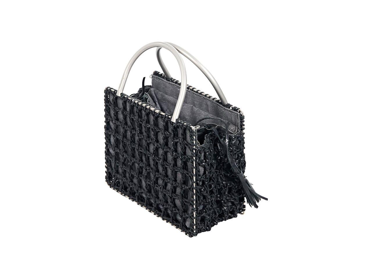 Product details:  Black twisted leather and fabric evening bag by Salvatore Ferragamo.  Dual carry handles.  Top drawstring closure.  Lined interior.  Silvertone hardware.  7