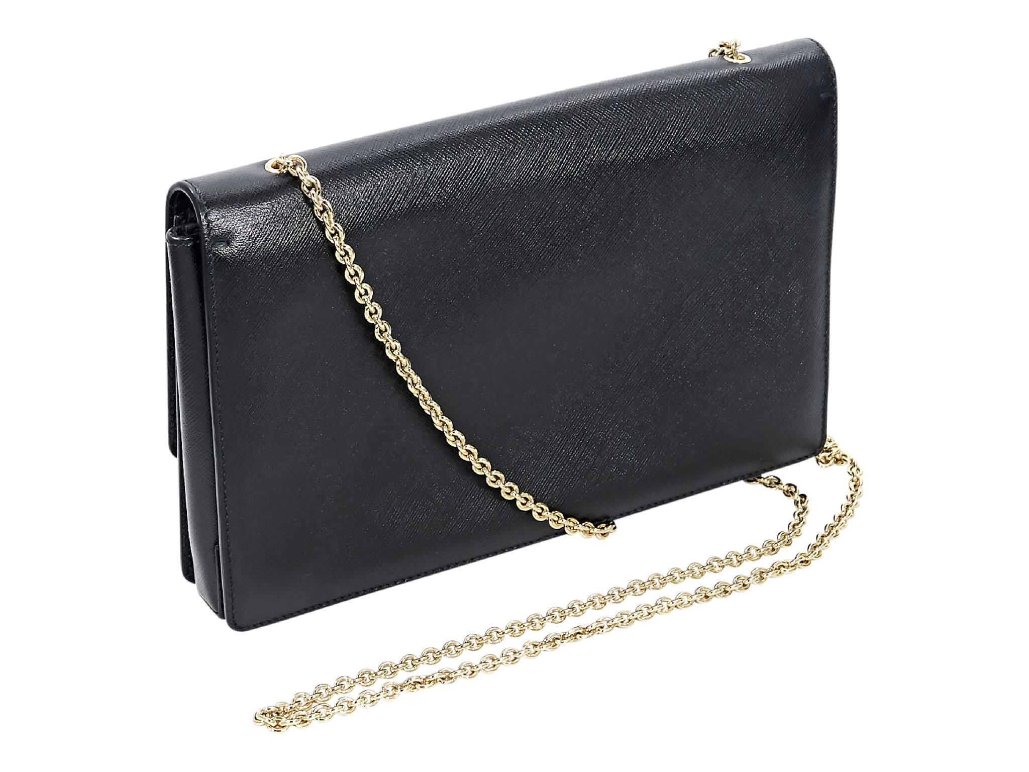 Product details:  Black saffiano leather Miss Vara crossbody bag by Salvatore Ferragamo.  Tuck-away chain crossbody strap.  Front flap with magnetic snap closure.  Lined interior with inner zip pocket.  Goldtone hardware.  Dust bag included.  10