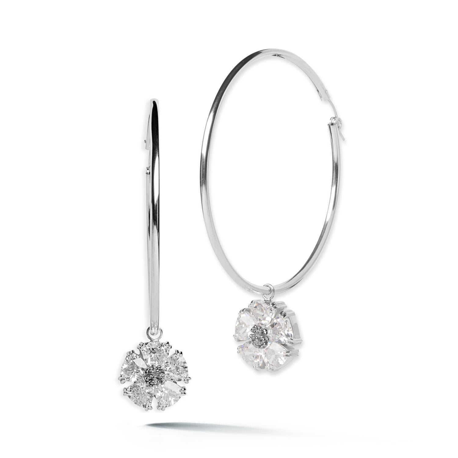 Designed in NYC

.925 Sterling Silver 10 x 7 mm Black Sapphire Blossom Stone Dangle Hoops. No matter the season, allow natural beauty to surround you wherever you go. Blossom stone dangle hoops: 

	Sterling silver 
	High-polish finish
	Light-weight