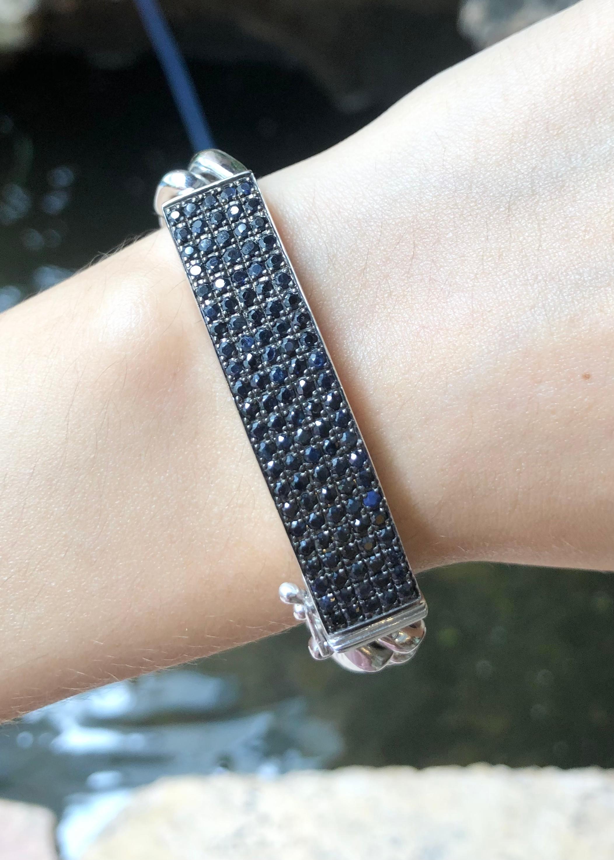 Black Sapphire 3.70 carats Bracelet set in Silver Settings

Width:  1.1 cm 
Length: 18.0 cm
Total Weight: 61.77 grams

*Please note that the silver setting is plated with rhodium to promote shine and help prevent oxidation.  However, with the nature