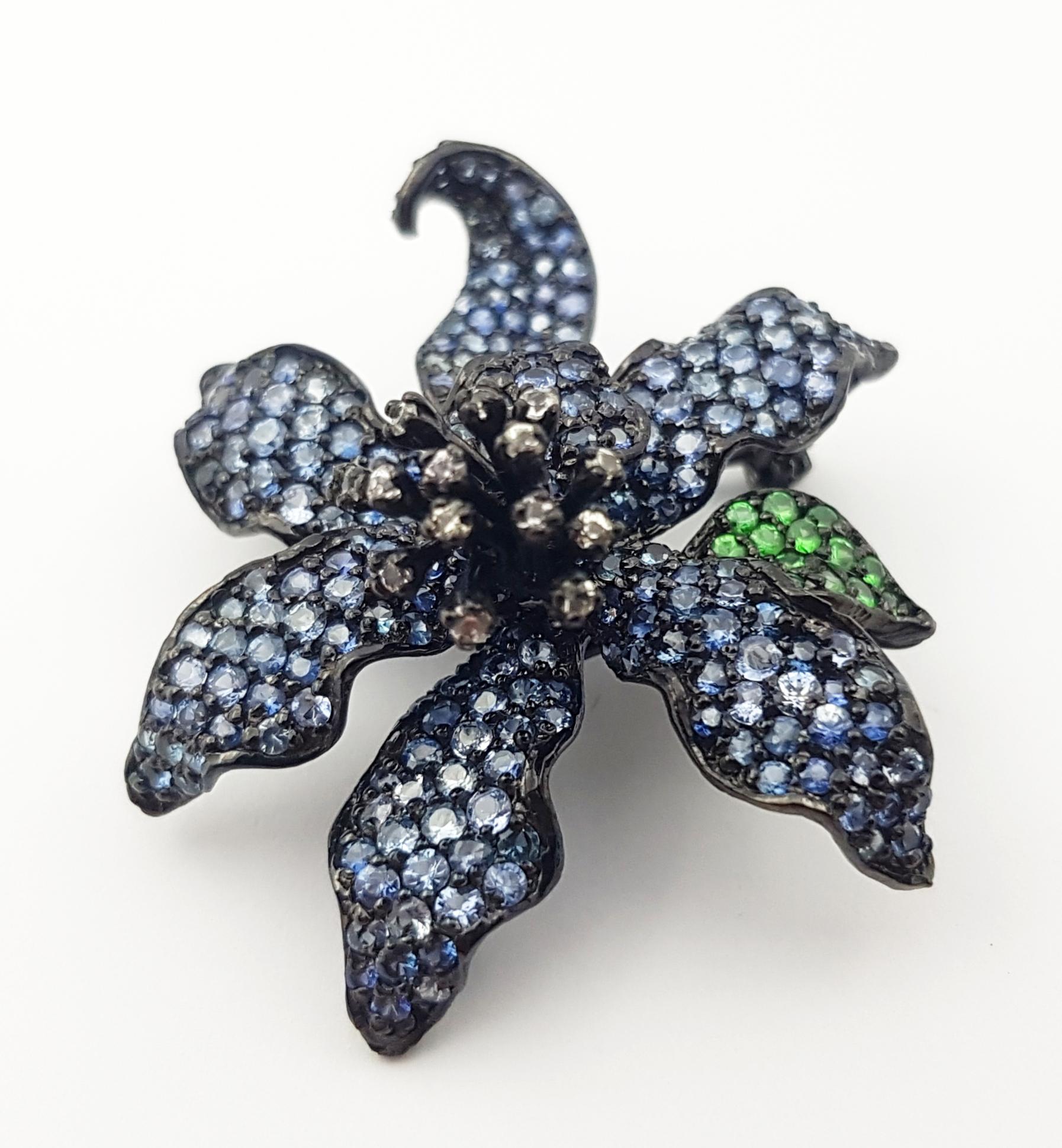 Black Sapphire, White Sapphire and Tsavorite Pendant/Brooch set in Silver Settings
(chain not included)

Width: 3.5 cm 
Length: 4.2 cm
Total Weight: 11.75  grams

*Please note that the silver setting is plated with rhodium to promote shine and help