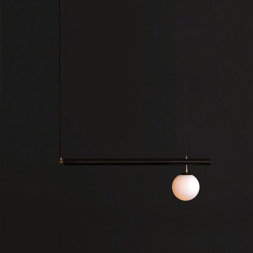 Black Satellite I, sculpted pendant by Paul Matter
Satellite I
Blackened brass with brushed brass details.
Dimensions: 183 x 88.9 x 15.3

Satellite is inspired by the conceptual and minimalist movement of the 1960s and 1970s. These light sculptures
