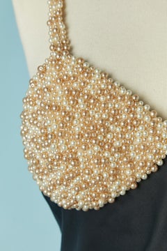 Black satin cocktail dress with pearls on the bust CHANTAL THOMASS