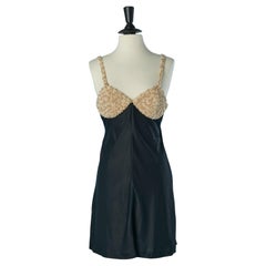 Black satin cocktail dress with pearls on the bust CHANTAL THOMASS Black satin cocktail dress with pearls on the bust CHANTAL THOMASS