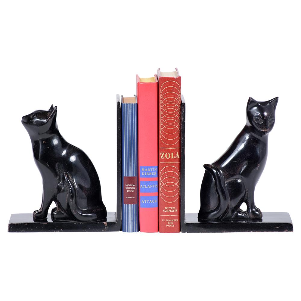 A pair of modern decorative bookends beautiful crafted out metal, these bookends feature and a cat sculpture and deep ebonized color and are eye-catching a perfect addition to any office or home decor.