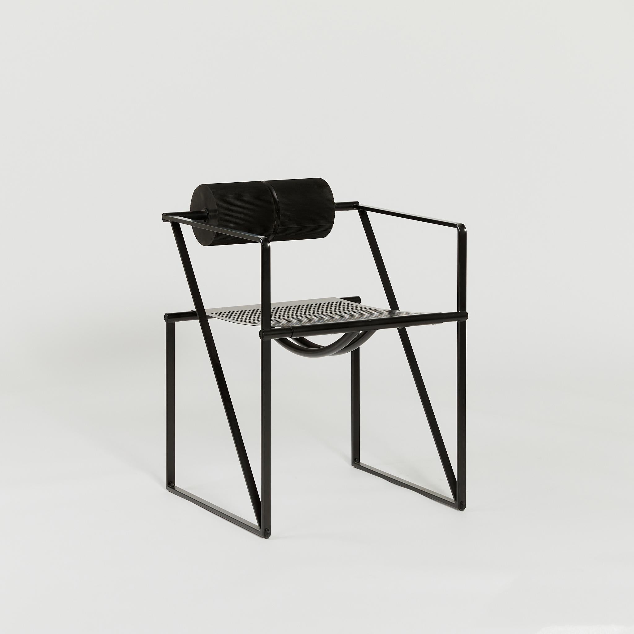 The iconic Seconda chair is constructed with a cube steel frame and ribbed foam back-rest. 

Born in 1943 in Mendrisio, Switzerland, award-winning architect-designer Mario Botta has built an international reputation for striking postmodern public