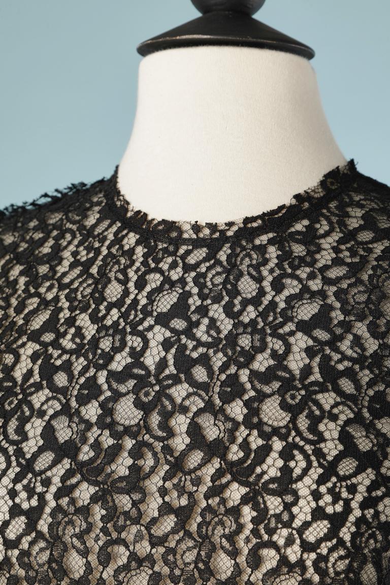 Black see-though lace on a tulle base. Zip in the middle back. 
SIZE 36 (Fr) 4 (US) 