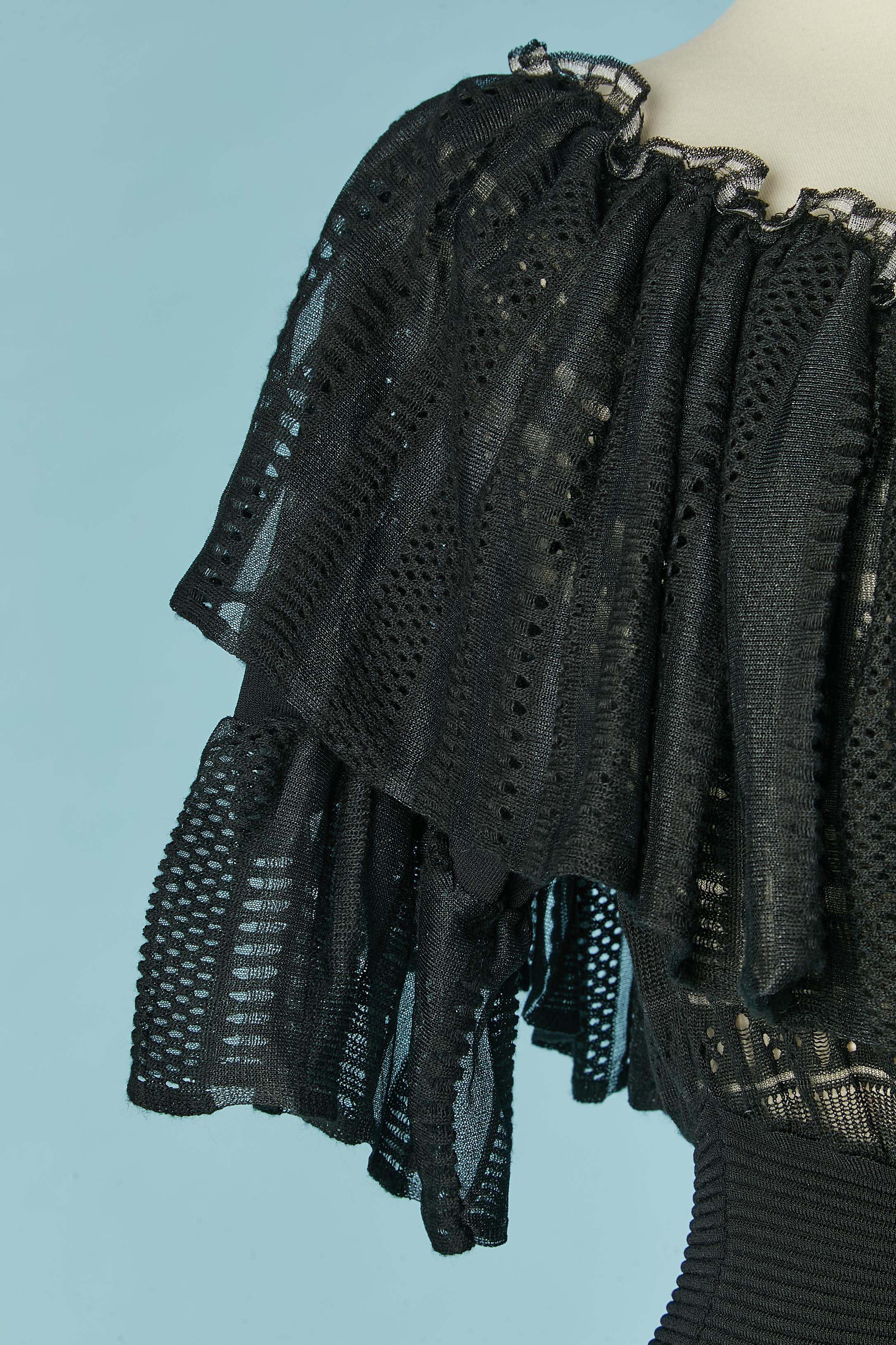 Black see-through cocktail dress with ruffles neckline. Fabric composition: 65% rayon, 35% nylon
SIZE L on tag but fit more likely M 