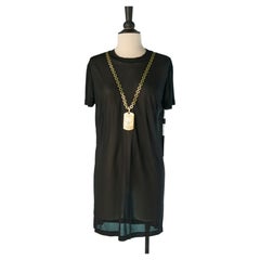 Vestido negro de jersey transparente con escote de cadena VIONNET
