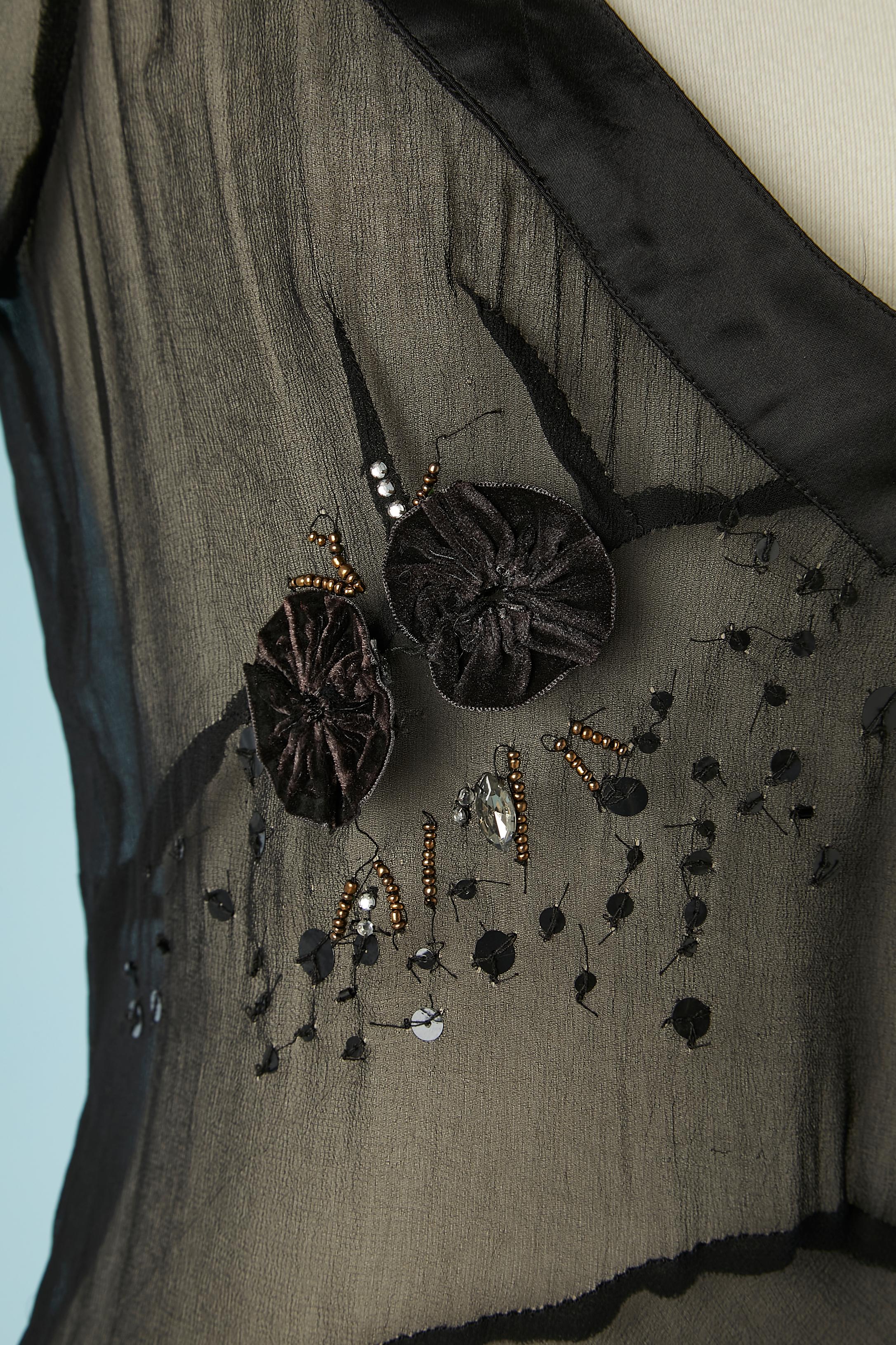 Black see-through silk chiffon dress with embroideries. Zip on the left side.
Authentification hologram. Fabric composition: rayon and polyester.
SIZE 42 (It) 38 (Fr) M 