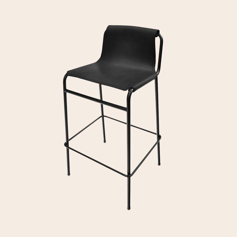 Black September Bar Stool by OxDenmarq
Dimensions: D 38 x W 42 x H 93 cm
Materials: Leather, Black Powder Coated Steel
Also Available: Different colors available

OX DENMARQ is a Danish design brand aspiring to make beautiful handmade
