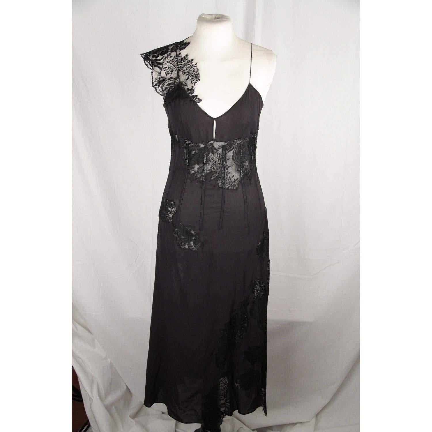- Black Sheer Fabric - Lace insert - Black color - Stays on the upper - Spaghetti strap with asymmetric lace detail - Hook & Eye closure - Size is not indicated. Estimated size is a SMALL size Measurements: - Bust (Flat - from underarm to underarm):