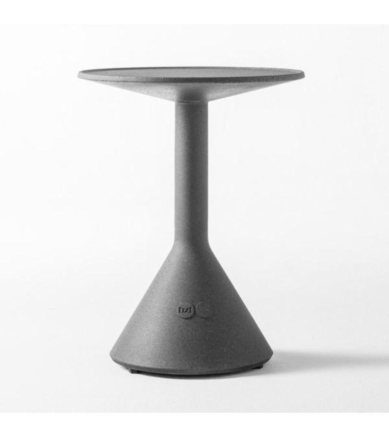 Black side table B by Konstantin Grcic
Dimensions: Diameter 40 x height 51 cm
Materials: A solid architectural piece in grey or black. Incorporated with regulatory glides.
Available in grey. 


A solid and elegant side table of service, signed