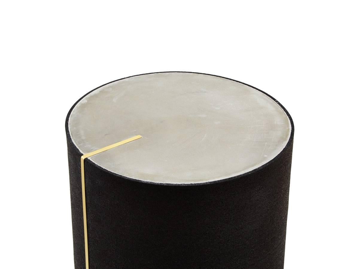 Black concrete rubber side table with a brass inlay created by Slash Objects

Materials: Rubber exterior in black, concrete surface, brass inlay

Made in USA.

   