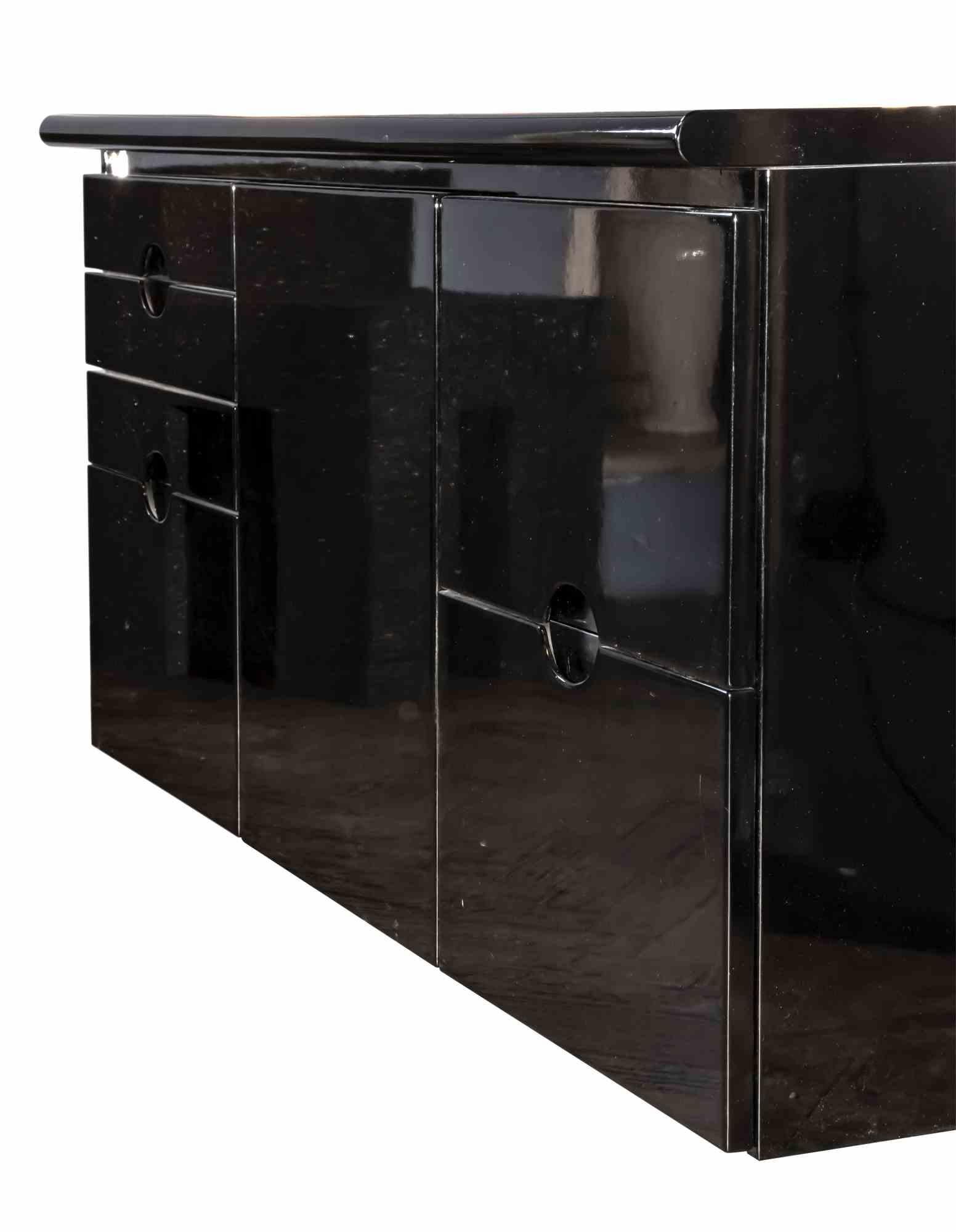 Black sideboard is an original design furniture item realized by Luigi Caccia Dominioni for Azucena in the 1960s.

A black lacquered wood sideboard

Founded in 1947 by Luigi Caccia Dominioni, Ignazio Gardella and Corrado Corradi Dell’Acqua, the