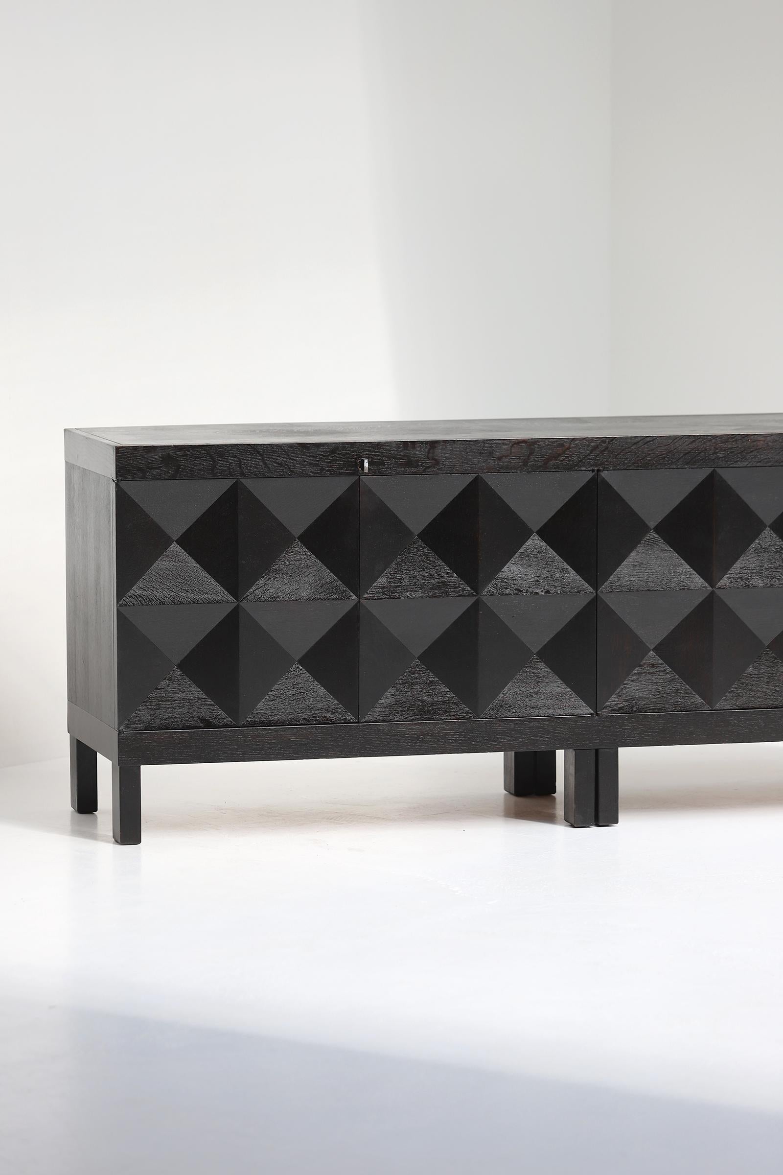 Beautiful and quality crafted sideboard with op-art doors designed by J. Batenburg for MI, Belgium 1969. These quality Belgian made furniture were definitely built during the late 60s and early 70s. Some dealers do sell this as a product from De