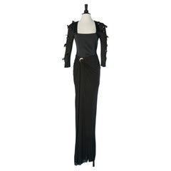 Black silk and jersey evening gown with embroideries on the sleeves Versace 