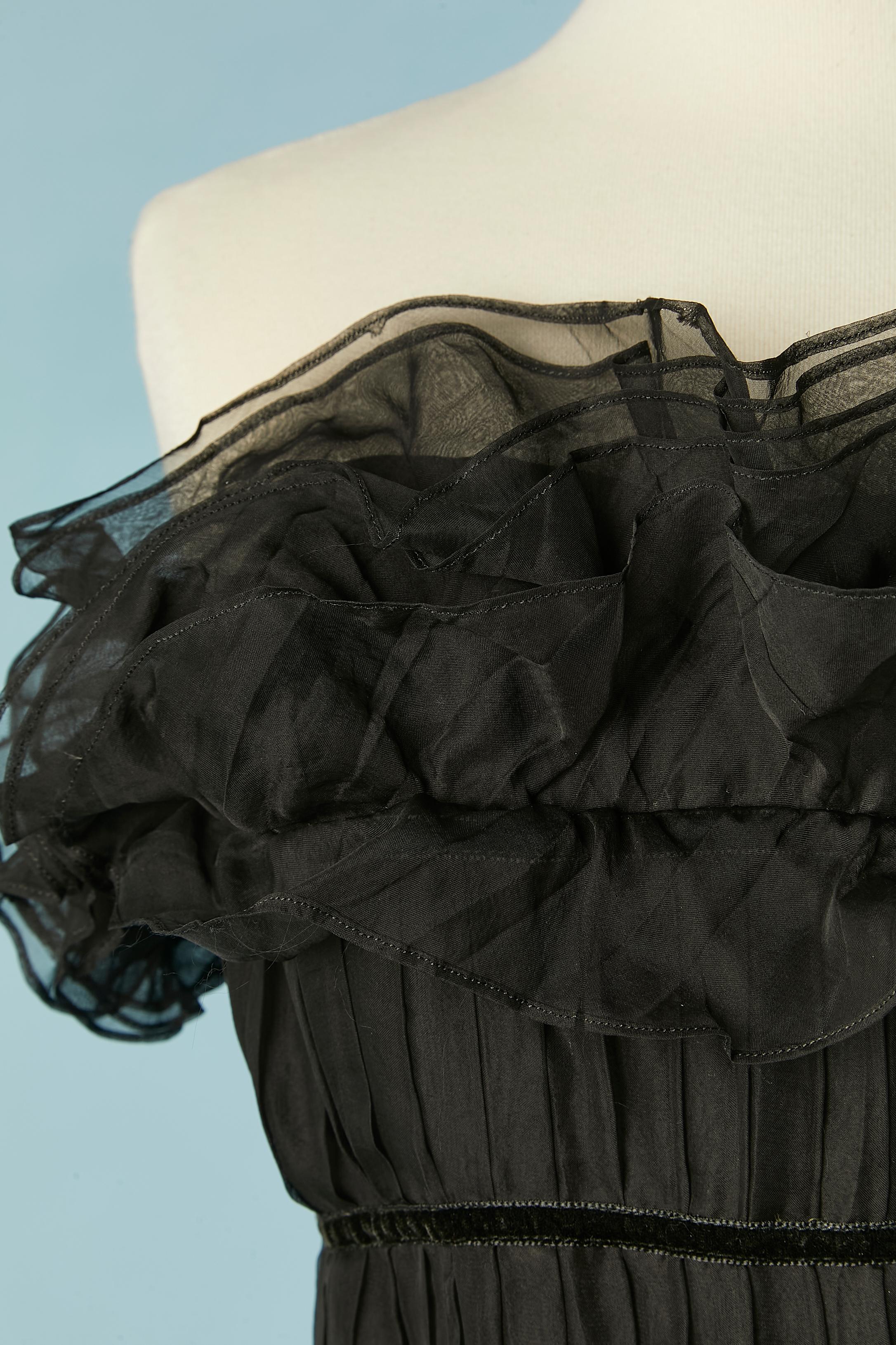 Black silk chiffon bustier cocktail dress with ruffles and black velvet ribbons piping. 
Boned silk chiffon bustier inside the dress with snap and hook and eye closure. 
Elastic waist band and elastic under-bust band. Hidden zip and hook&eye closure