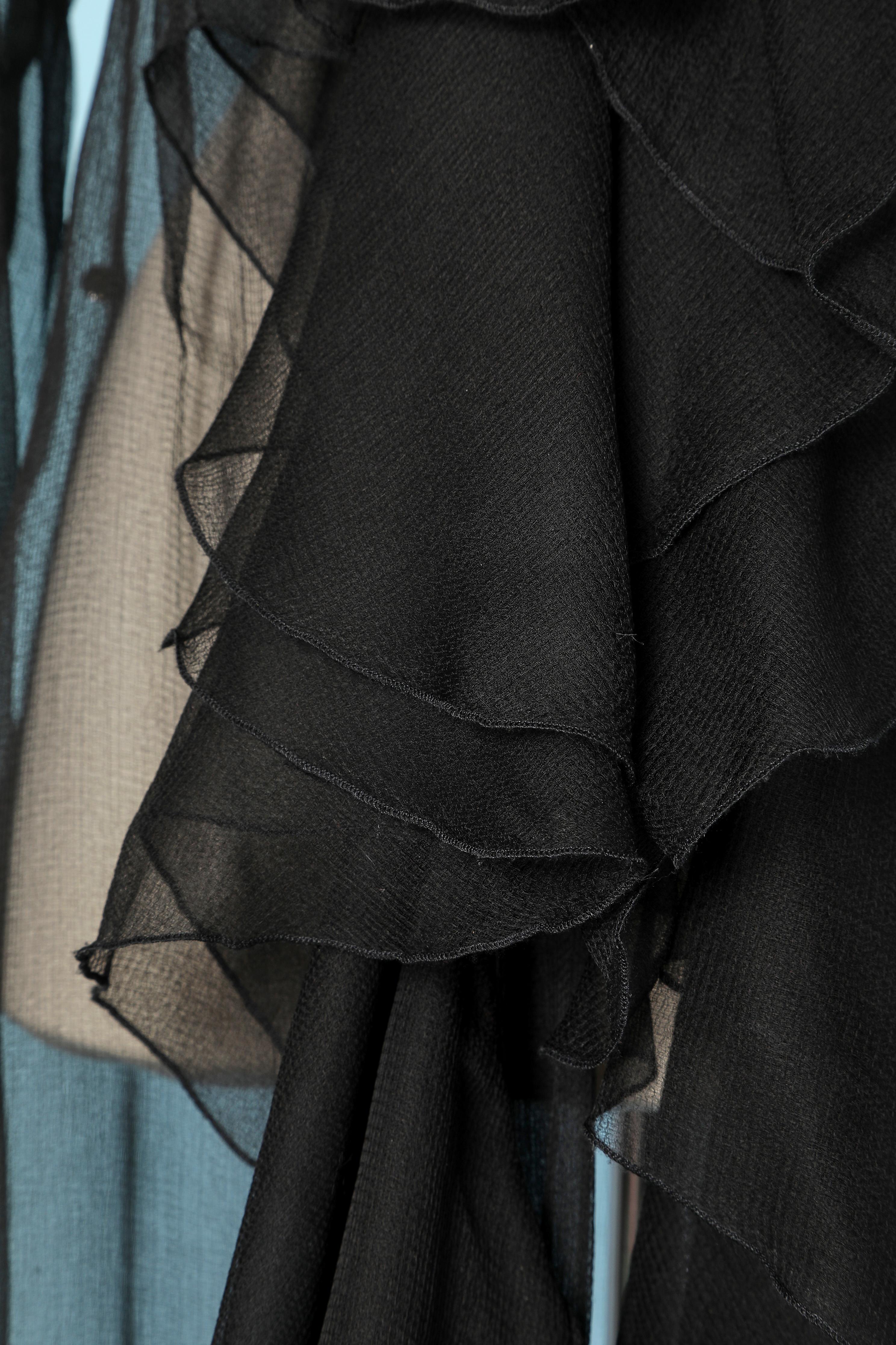 Black silk chiffon coat with ruffle edge. One rhinestone on the side on the waist
SIZE 40(L) 