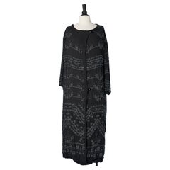 Black silk chiffon evening coat with beaded work, lightly padded Circa 1920