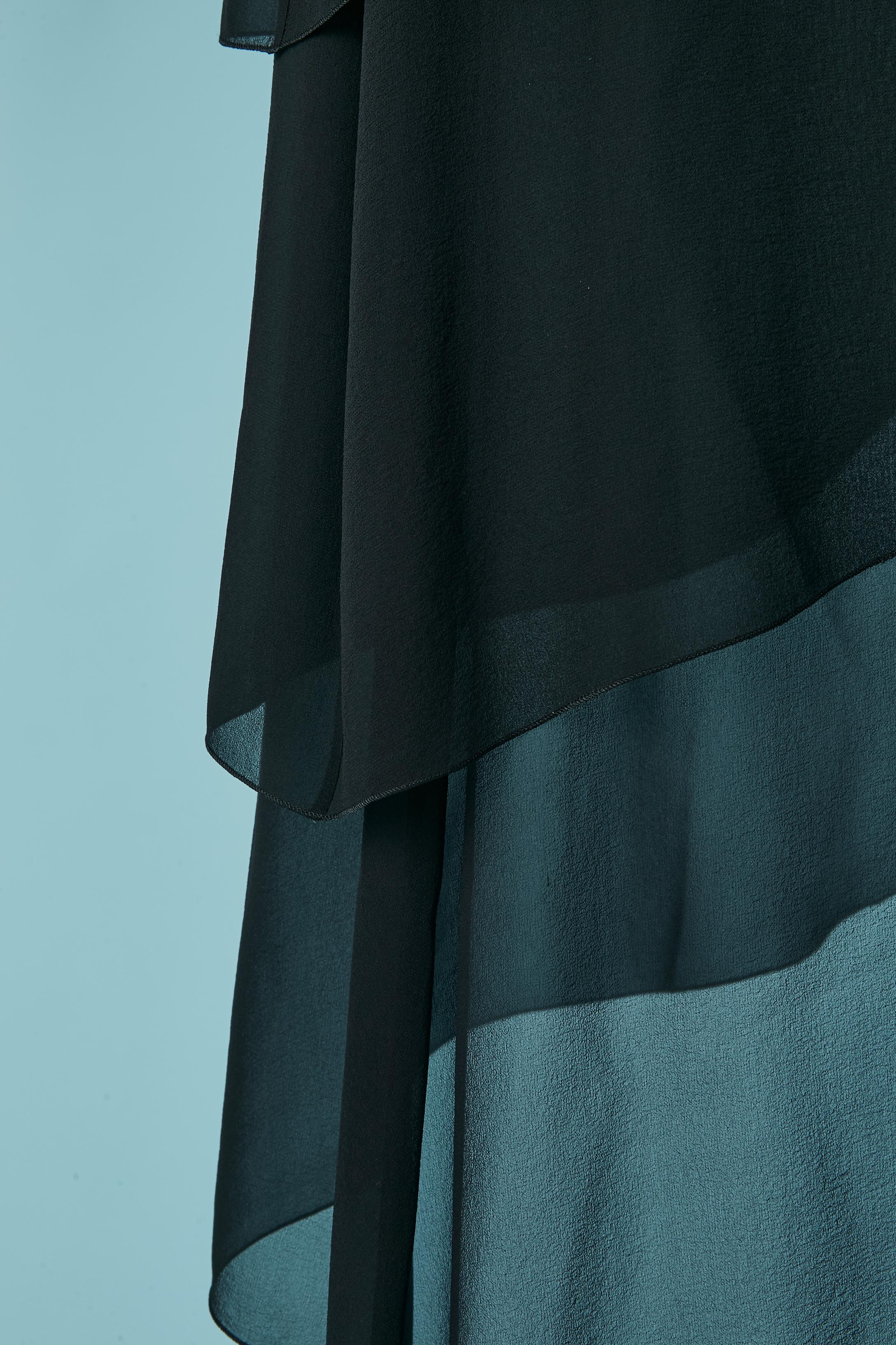 Gonna in chiffon di seta nera con lacci. Chiusura con zip invisibile sul lato sinistro + gancio e occhiello. 
TAGLIA 36 (Fr) S 