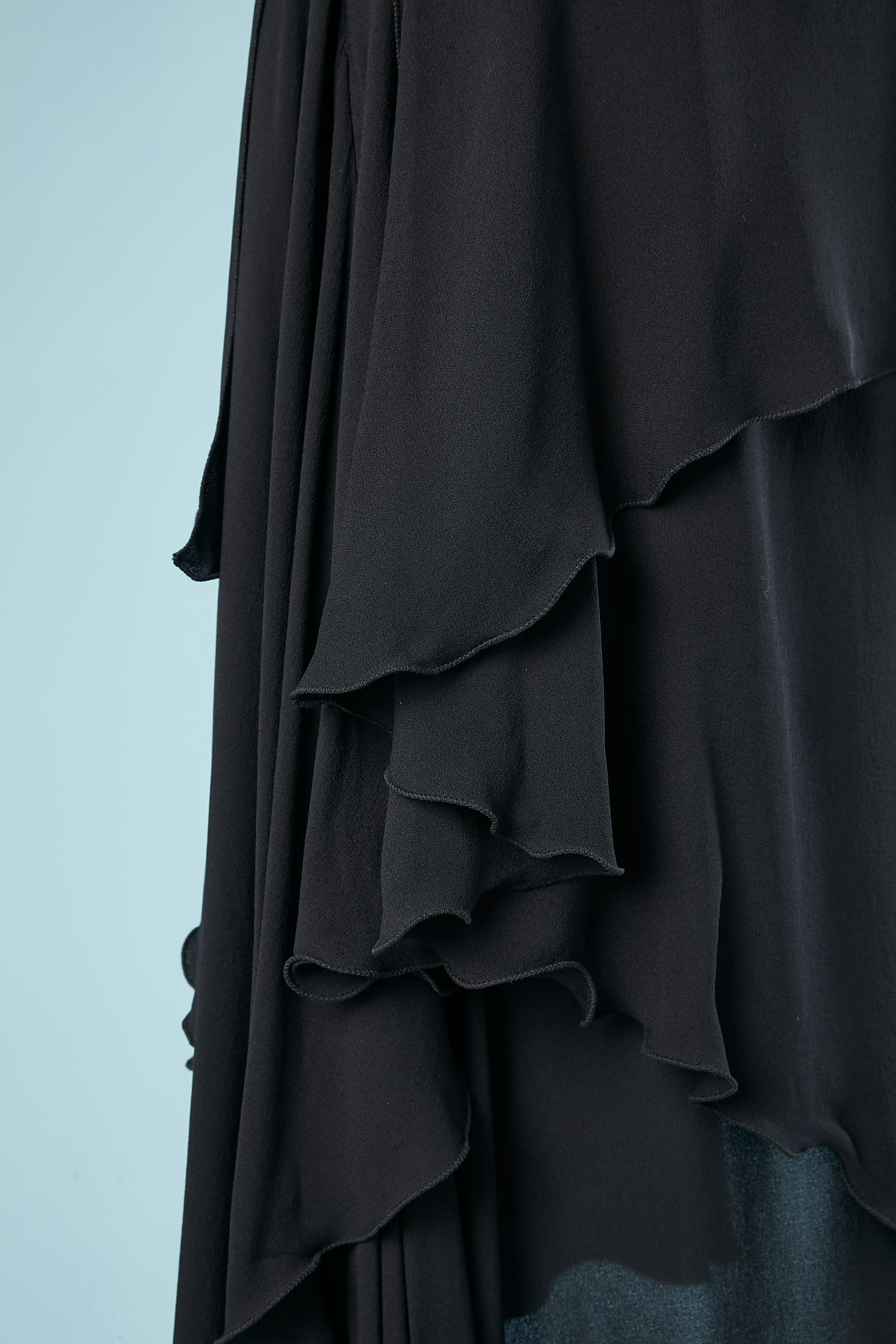 Black silk chiffon skirt with ruffles with zip on the side. 
SIZE 38