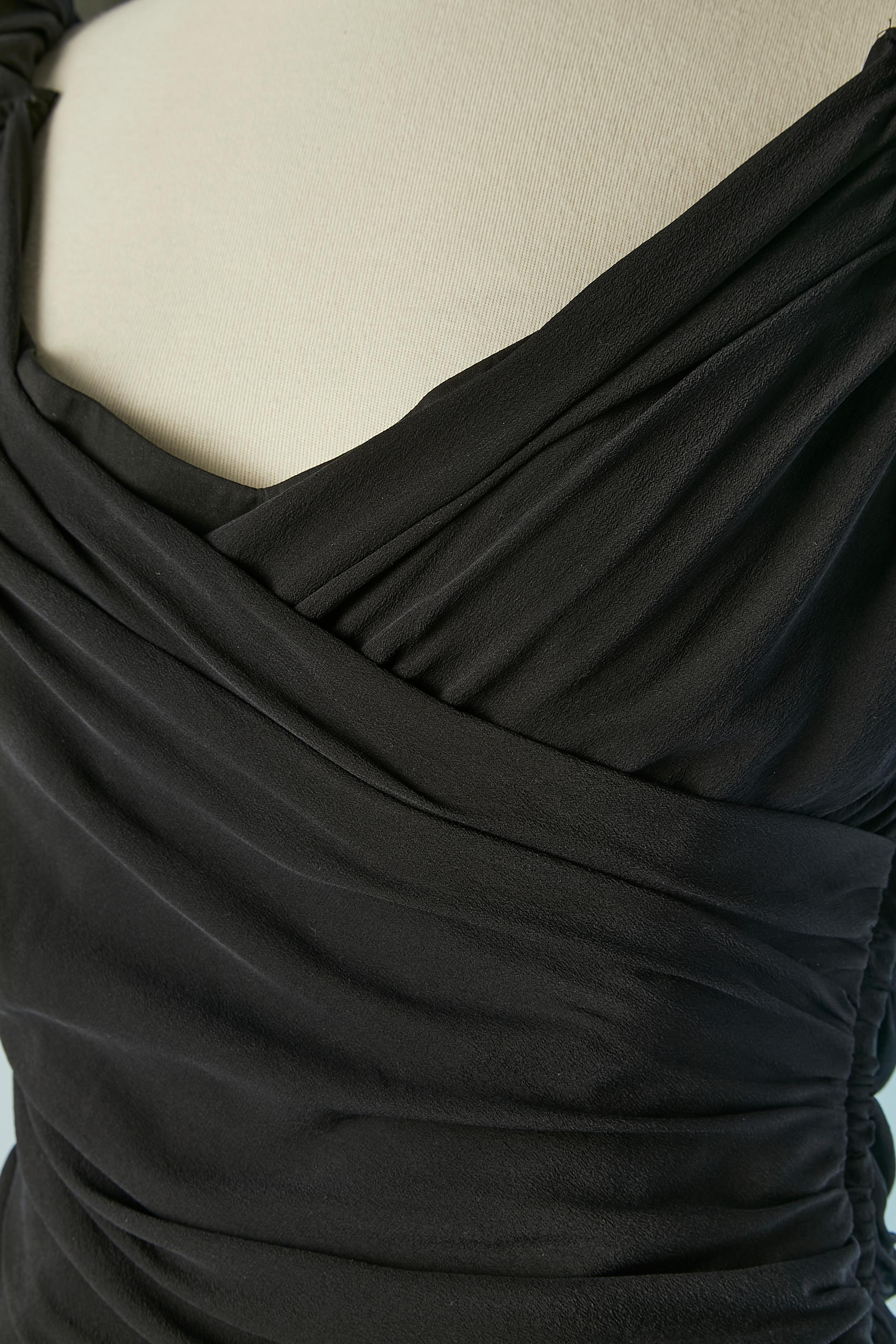 Black silk cocktail dress. Lining composition: 67% acetate, 33% polyester. 
Wrapped and draped on the bust and gather along the waist. Boned.
SIZE 46 (It) 42 (Fr) 