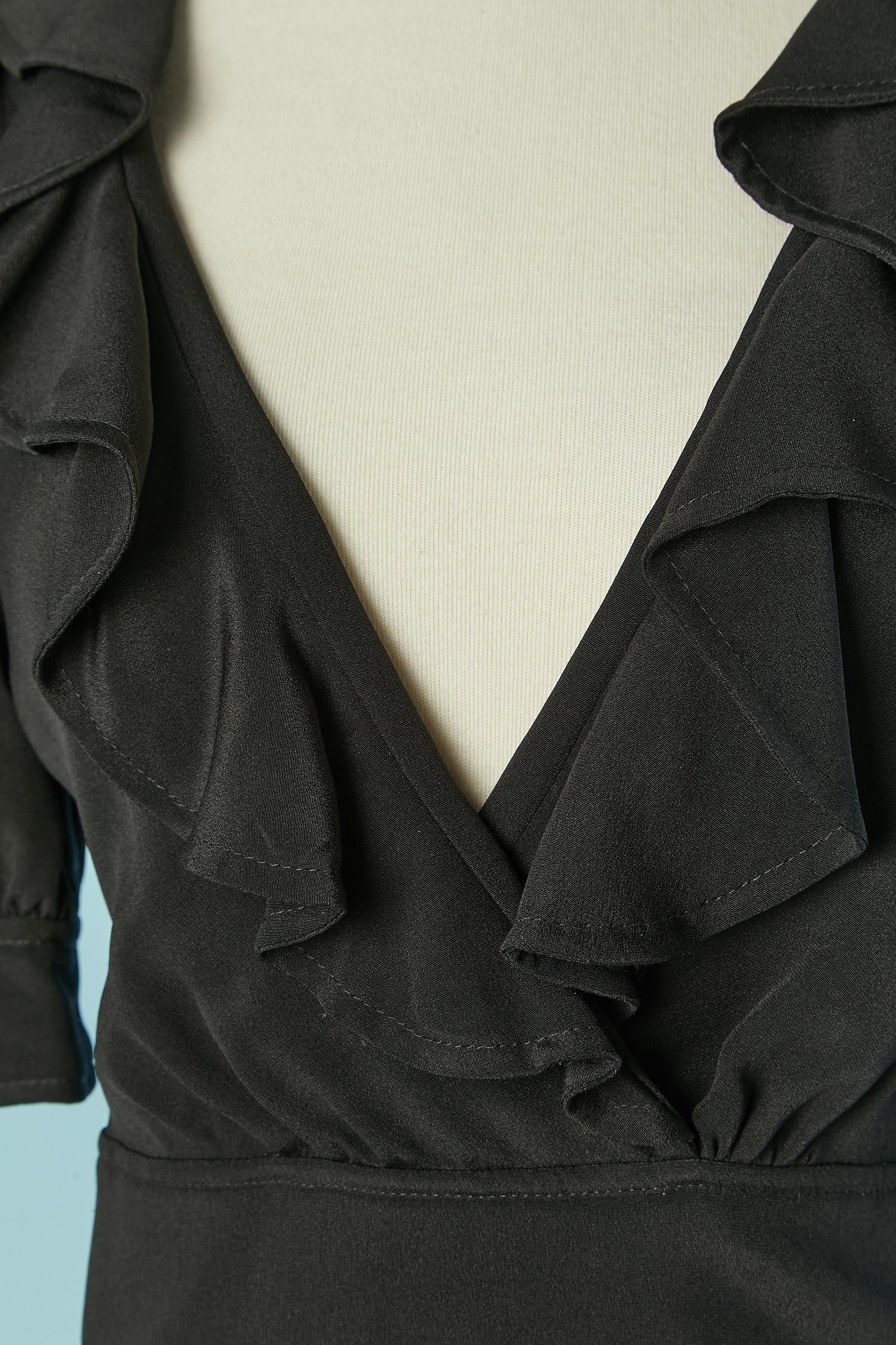 Black cocktail dress with ruffles along neckline. Silk lining as well. 
Zip closure on the left side Pocket on both side. 
size 38 (Fr) M 