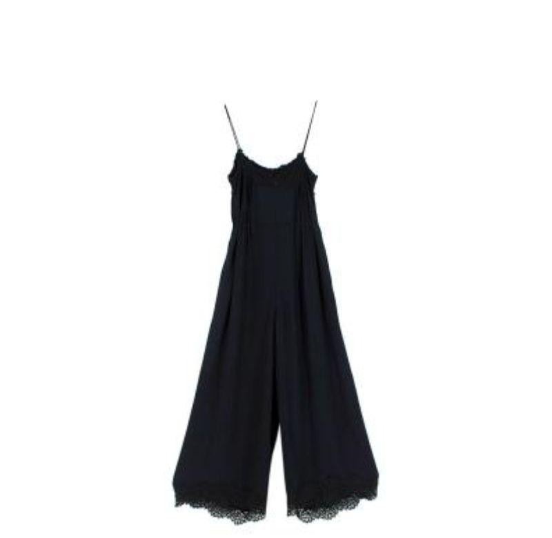 Zimmermann Black Silk Crepe de Chine Jumpsuit
 
 - Shoestring strap, wide-leg jumpsuit
 - Cropped, lace-trimmed legs
 - Lace-trimmed sweetheart neckline and pin-tucked bodice
 - Self-tie rouleaux waist belt 
 - Side slip pockets
 - Concealed zip