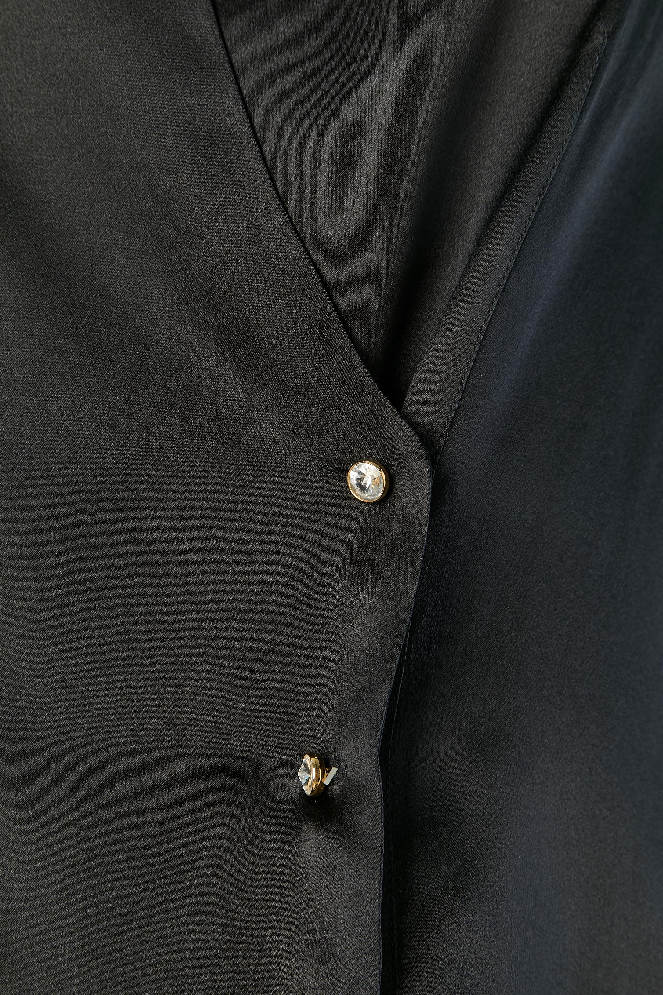 Black silk double breasted vest. Rhinestone button and buttonhole closure on the front. 
SIZE 40 / L 