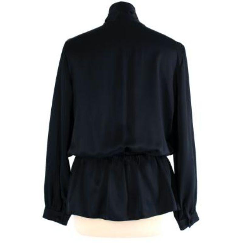 Balenciaga Black Silk Drawstring Blouse
 
 - Relaxed silhouette fit with elastic on the waist 
 - Attached ribbon scarf detail 
 - Frontal button up fastening 
 - Long sleeve with 
 
 Materials:
 100% Silk 
 
 Made in Italy 
 
 Dry clean only 
 
