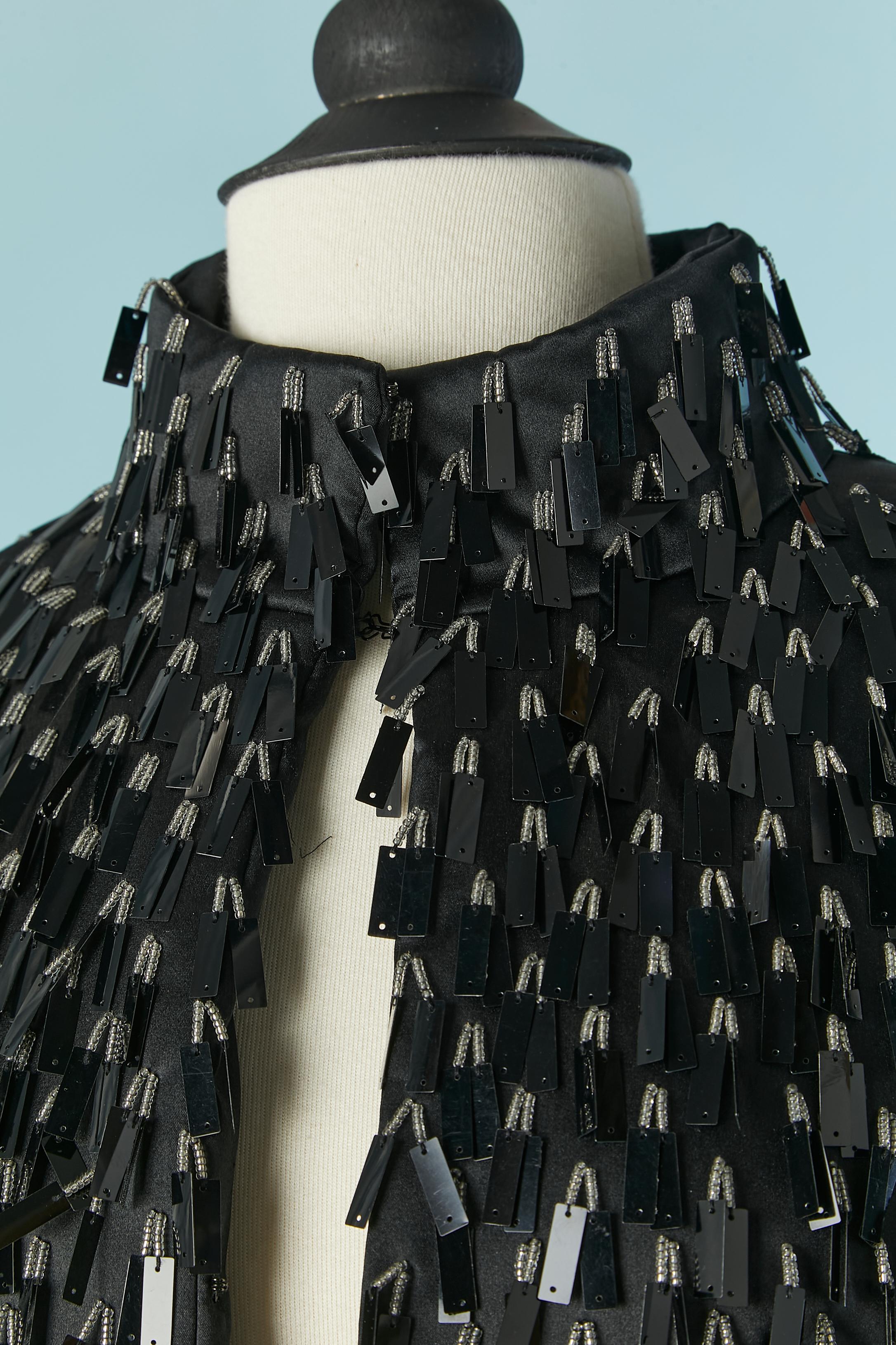 Black silk edge to edge jacket with black PVC and beads fringes. Hook and eye closure on the middle front. 
SIZE M 