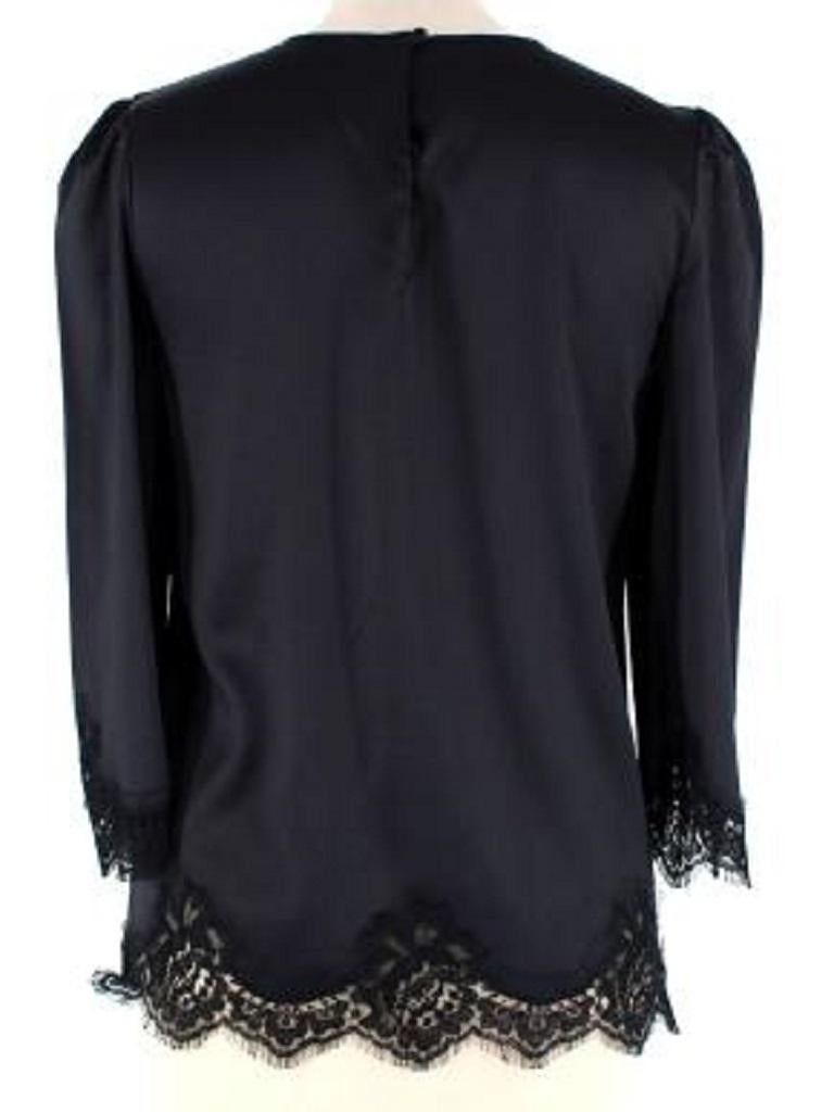 Dolce & Gabbana Black Silk & Lace Top
 

 

 - Luxurious silk round neck top with lace trims
 - Relaxed fit 
 - Mid length sleeves with black lace trims
 - 2 button closure at the back of the neck
 - Tailored darts at the bust
 

 

 

 - Made in