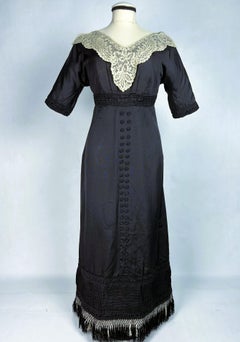 Black silk ottoman and lace dress in the style of Paul Poiret, France C. 1910