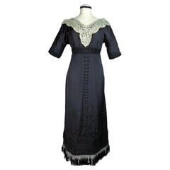 Black silk ottoman and lace dress in the style of Paul Poiret, France C. 1910