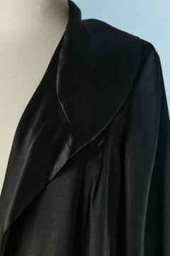 Black silk satin evening coat with ruffles on the bottom edge Circa 1925/30
