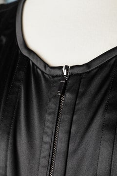 Black silk top with zip in the front and quilted top-stitched strips Chanel