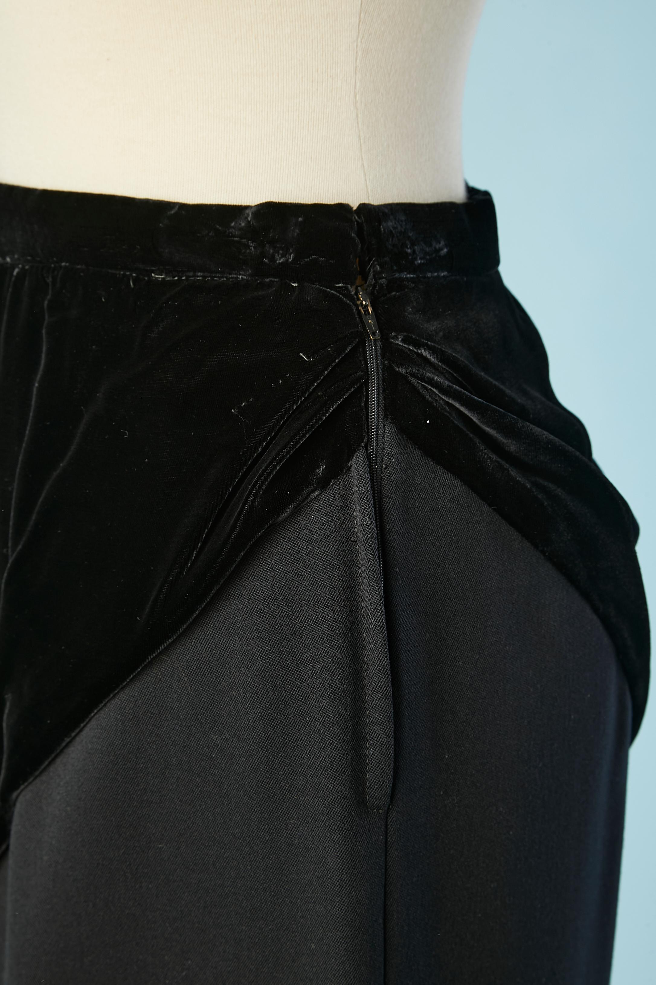 Black silk velvet and wool pencil skirt. Zip and hook&eye on the left side. Split on the left side as well, lenght= 22 cm
Rayon lining only inside the velvet part. 
SIZE XS 