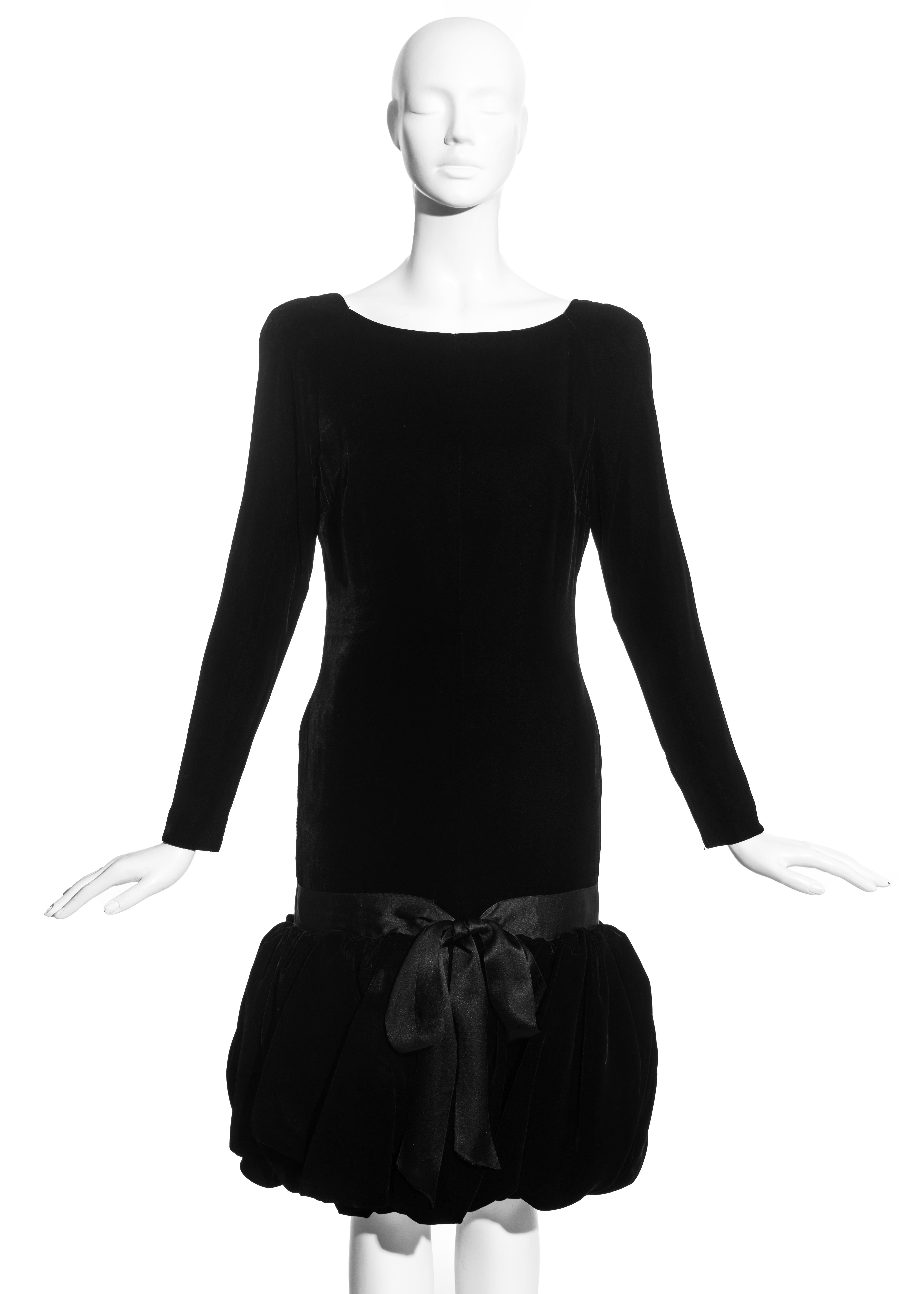Black silk velvet couture cocktail dress with drop waist, puffball skirt, ribbon bow fastening and silk lining. 

c. 1960