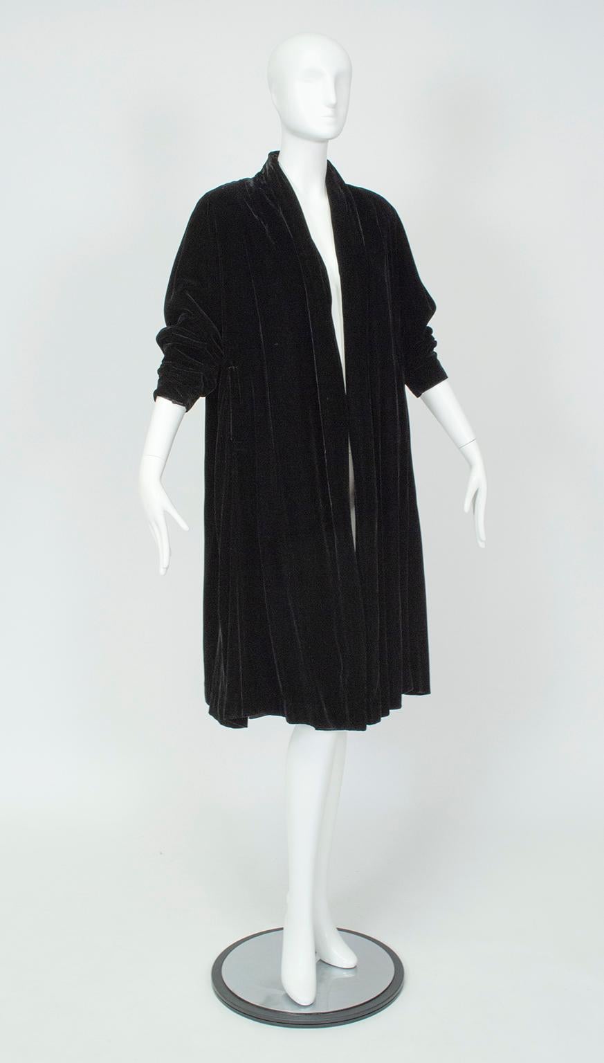 Favored in the mid-century because their volume allowed them to be worn over the full-skirted silhouettes of the time, opera coats still appear on modern runways due to their drama and versatility. Dramatic balloon sleeves and luxe silk velvet make